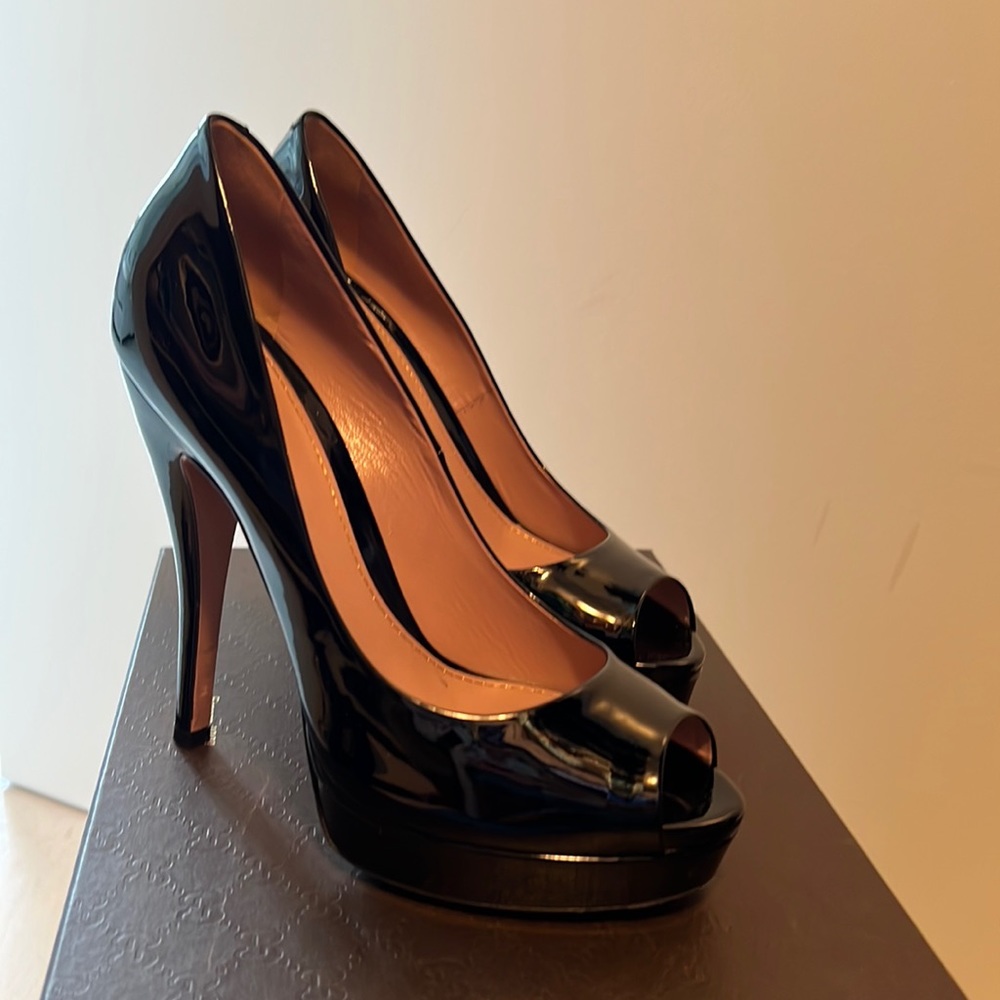 Gently used Gucci platform peep toe patent leather 38.5 heels.